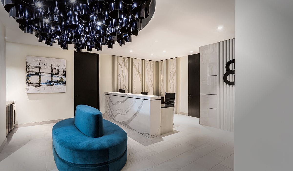 Body by Ravi Modern reception area with unique lighting design.