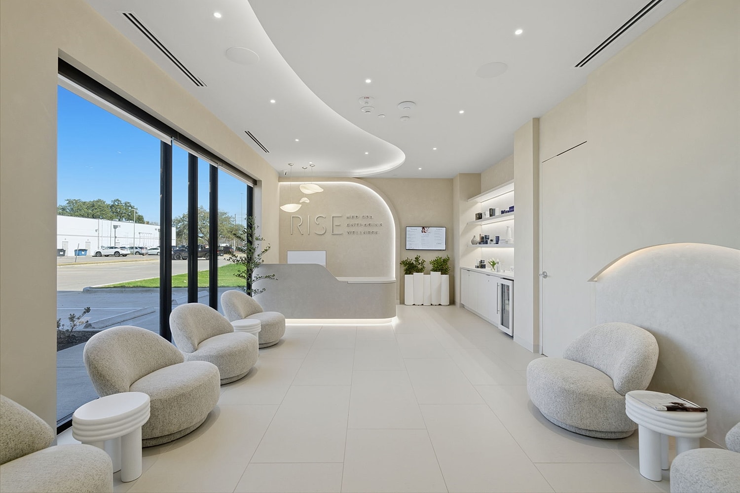 Body by Ravi Modern reception area with unique lighting design.