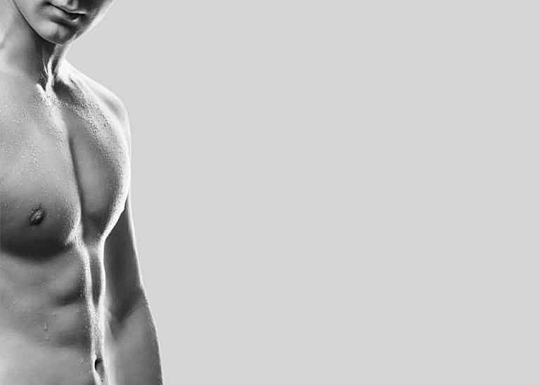 Black and white close-up of a toned torso.