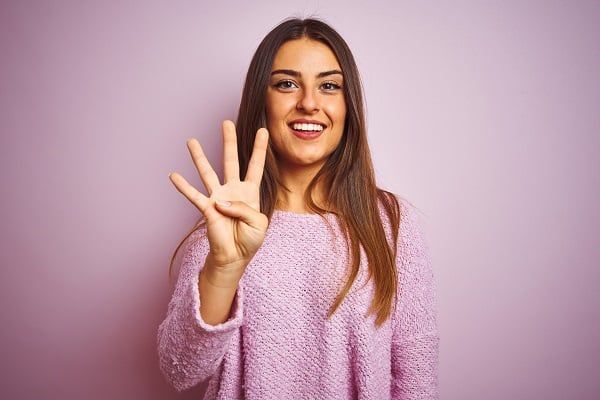 Young,Beautiful,Woman,Wearing,Casual,Sweater,Standing,Over,Isolated,Pink