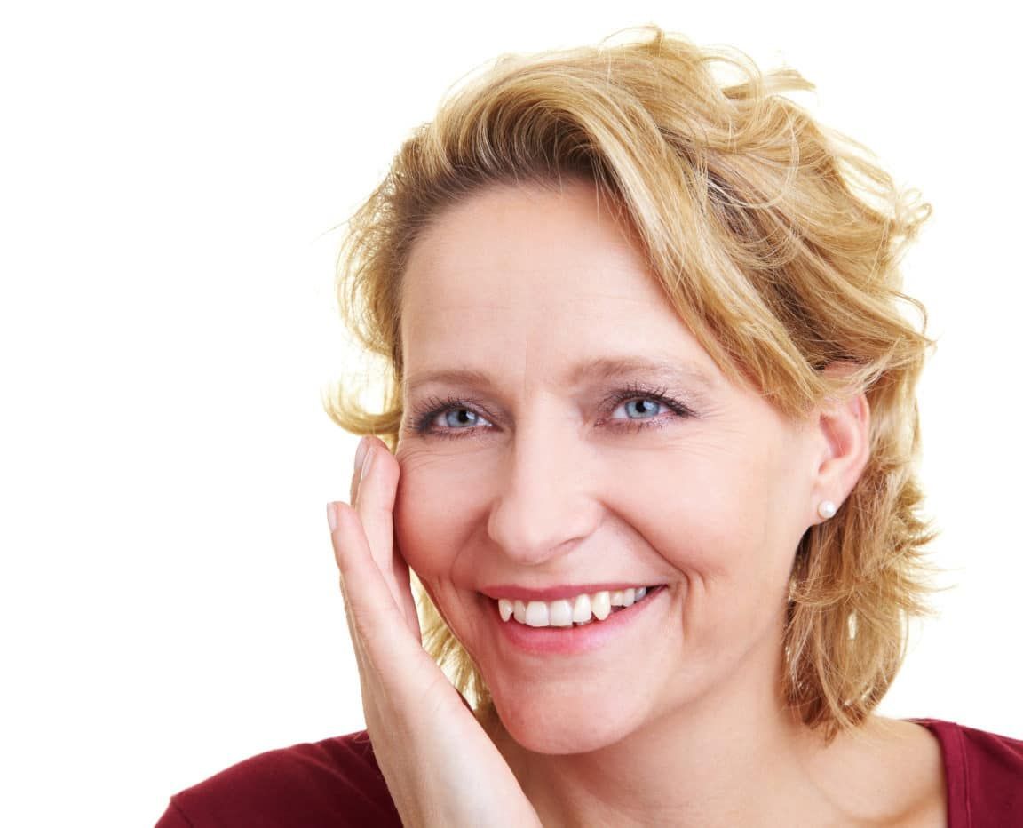 Older woman with smooth skin, smiling